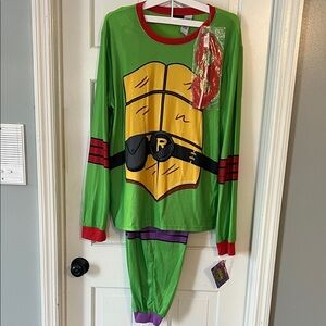 Nickelodeon Green and Red top and green/ purple bottoms. Ninja Turtle Pajama Set